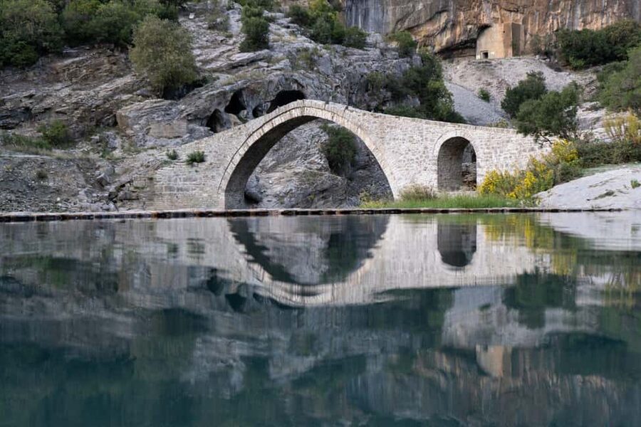 From Permet: Vjosa River Rafting and Benja Thermal Baths - Benja Thermal Baths beneath the stone bridge
