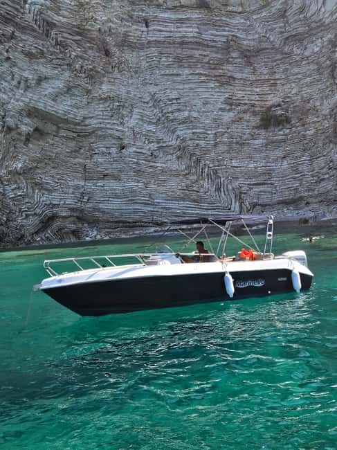 Sarandë: Boat Tour to Kroreza with Snorkel and free Umbrella - Qefal: rock, clear water, and a short swim