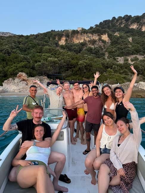 Sarandë: Sunset boat tour with local wine - Secret Beach and the longer swimming stop