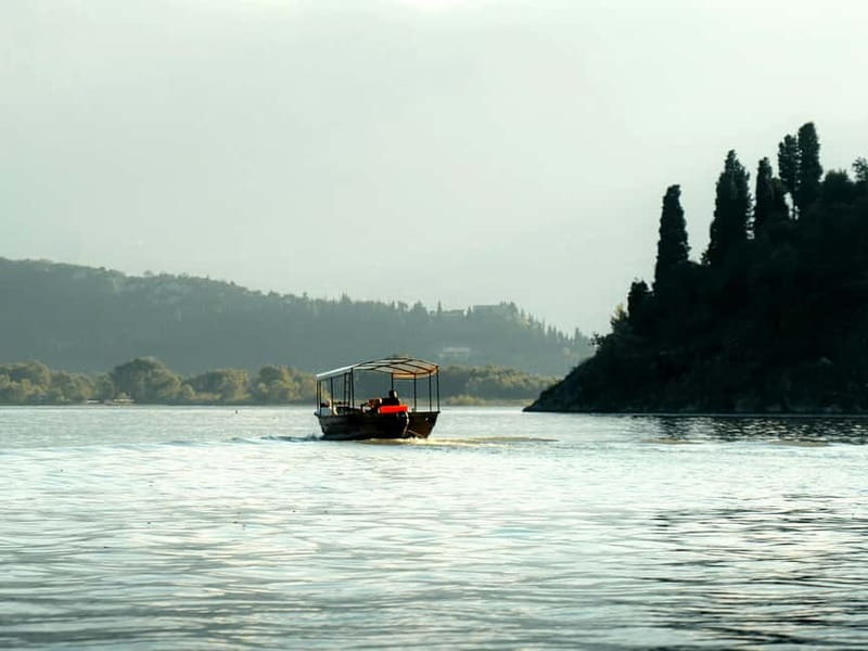 Skadar Lake National Park: Private Wooden Boat Tour & Wine - Leaving Virpazar Through the Willow Canal