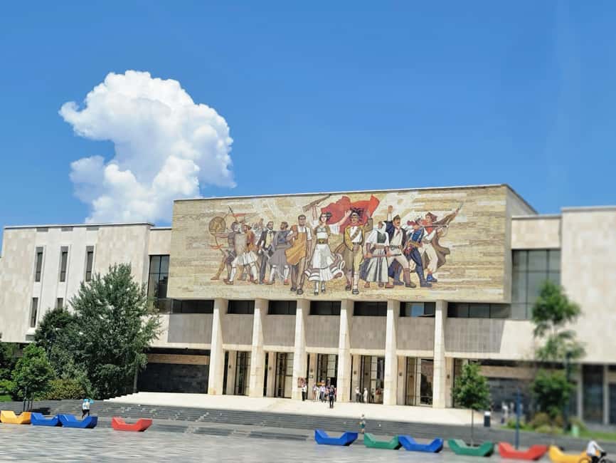 Tirana by Night: Walking Tour with Cocktail & City Lights - Starting at the Palace of Culture and Skanderbeg Square