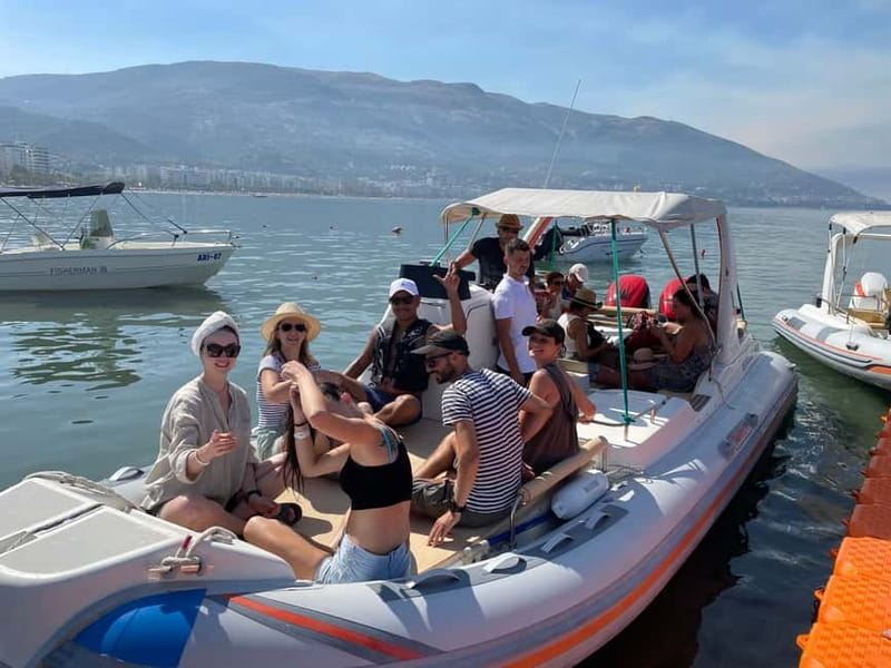 Vlore: Haxhi Ali Cave and Dafina Cave Speedboat Tour - Brsitan Bay, clear water, and a Communist-era relic